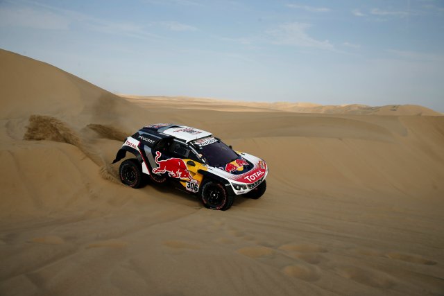 Dakar Rally - 2018 Peru-Bolivia-Argentina Dakar rally - 40th Dakar Edition stage three, Pisco to San Juan de Marcona - January 8, 2018.  Sebastien Loeb of France and copilot Daniel Elena of Monaco drive their Peugeot. REUTERS/Andres Stapff