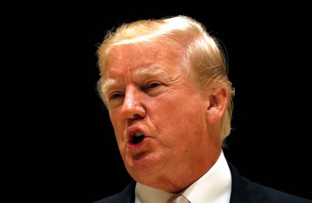 U.S. President Donald Trump speaks upon arrival for dinner at his golf club in West Palm Beach, Florida, U.S., January 14, 2018.  REUTERS/Kevin Lamarque