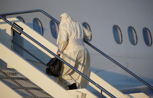 Pope Francis boards for his trip to Chile and Peru at Fiumicino International Airport in Rome, Italy, January 15, 2018. REUTERS/Max Rossi