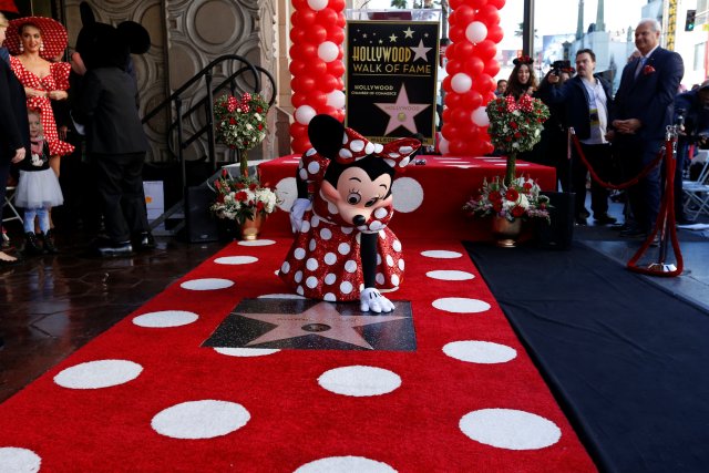 The character of Minnie Mouse poses on her star after it was unveiled on the Hollywood Walk of Fame in Los Angeles, California, U.S., January 22, 2018. REUTERS/Mario Anzuoni