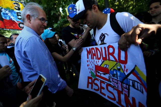 Antonio Ledezma, Venezuelan opposition leader, attends a rally as members of the Lima Group nations meet in Santiago, Chile January 23, 2018. The banner reads "Maduro murderer". REUTERS/Ivan Alvarado