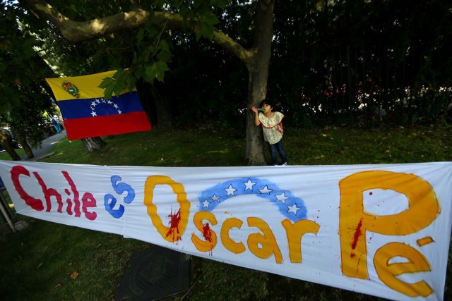A banner partially reads "Chile is Oscar Perez", regarding ex-policeman, is seen during a rally against Venezuela's government as members of the Lima Group nations meet in Santiago, Chile January 23, 2018. REUTERS/Ivan Alvarado