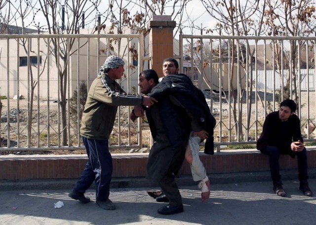 An injured man is carried after a blast in Kabul, Afghanistan January 27, 2018. REUTERS/Mohammad Ismail