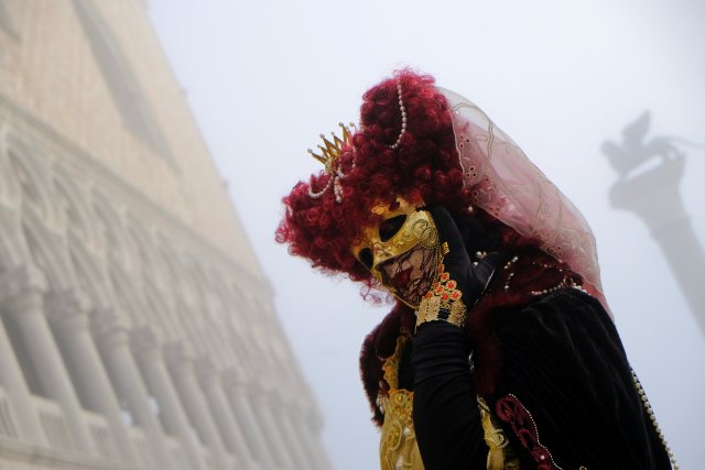 A masked reveller poses during the Carnival in Venice, Italy January 28, 2018. REUTERS/Manuel Silvestri