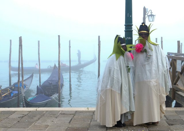 Masked revellers pose during the Carnival in Venice, Italy January 28, 2018. REUTERS/Manuel Silvestri