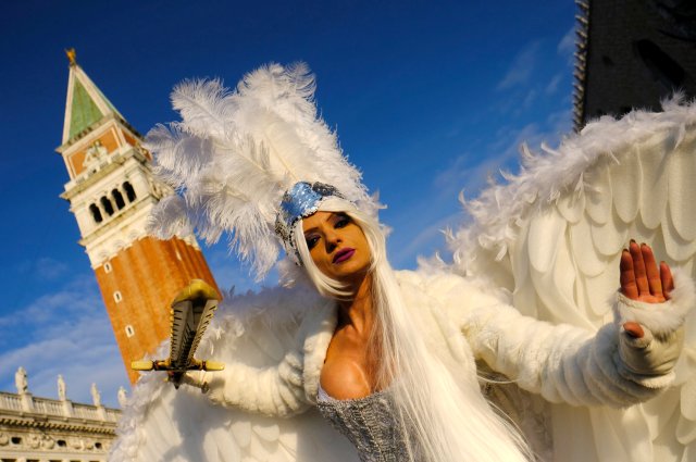 A masked reveller poses during the Venice Carnival, Italy, February 4, 2018. REUTERS/Manuel Silvestri