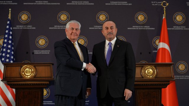 U.S. Secretary of State Rex Tillerson shakes hands with Turkish Foreign Minister Mevlut Cavusoglu after a news conference in Ankara, Turkey, February 16, 2018. REUTERS/Stringer NO RESALES. NO ARCHIVES