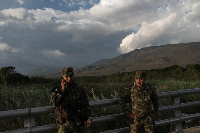 CUCUTA, COLOMBIA - AUGUST 24, 2017: Colombian soldiers keeps watch along the international border bridge between Colombia and Venezuela.