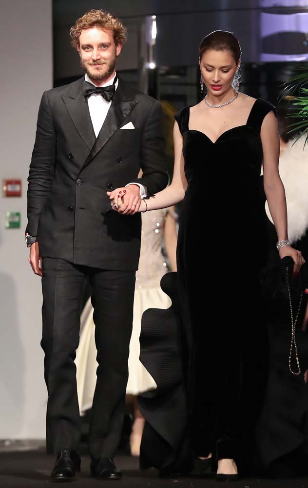 Pierre Casiraghi (L) and his wife Beatrice Casiraghi arrive for the annual Rose Ball at the Monte-Carlo Sporting Club in Monaco, on March 24, 2018. The Rose Ball is one of the major charity events in Monaco. Created in 1954, it benefits the Princess Grace Foundation. / AFP PHOTO / POOL / VALERY HACHE