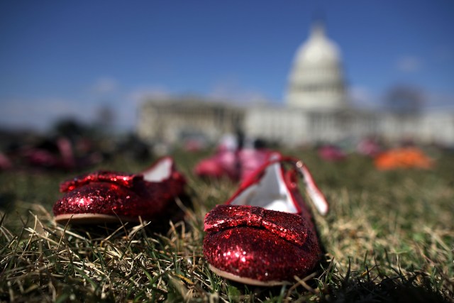 WASHINGTON, DC - MARCH 13: Seven thousand pairs of shoes, representing the children killed by gun violence since the mass shooting at Sandy Hook Elementary School in 2012, are spread out on the lawn on the east side of the U.S. Capitol March 13, 2018 in Washington, DC. Organized by the online activist group Avaaz, the shoes are intended to urge Congress to pass gun-reform legislation. Chip Somodevilla/Getty Images/AFP