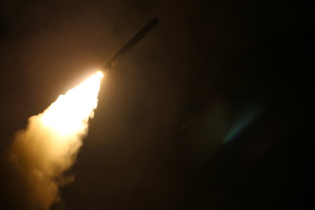 The U.S. Navy guided-missile cruiser USS Monterey fires a Tomahawk land attack missile April 14, 2018. U.S. Navy/Lt. j.g Matthew Daniels/Handout via REUTERS. ATTENTION EDITORS - THIS IMAGE WAS PROVIDED BY A THIRD PARTY