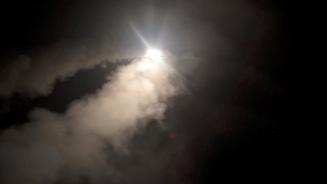 Smoke trails a missile as the U.S. Navy guided-missile cruiser USS Monterey fires Tomahawk land attack missiles in this still image from Pentagon's video released on April 14, 2018.   U.S. Navy Lt. j.g Matthew Daniels/Handout via REUTERS. ATTENTION EDITORS - THIS IMAGE WAS PROVIDED BY A THIRD PARTY