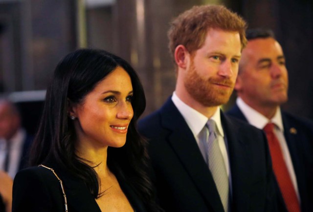 Los príncipes Harry y Meghan Markle de Gran Bretaña asisten a una recepción para celebrar los próximos Invictus Games Sydney 2018, auspiciados por Malcolm Turnbull, primer ministro de Australia, y su esposa Lucy Turnbull, en Australia House en Londres, Reino Unido, el 21 de abril de 2018. Alastair Grant / Pool via Reuters