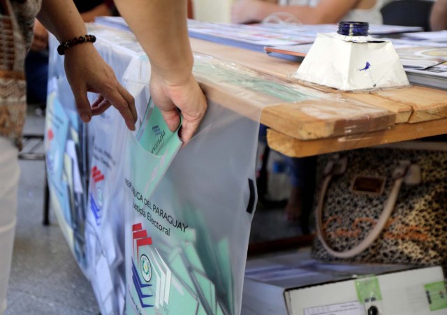 A woman casts her ballot during national election day in Asuncion, Paraguay April 22, 2018. REUTERS/Mario Valdez