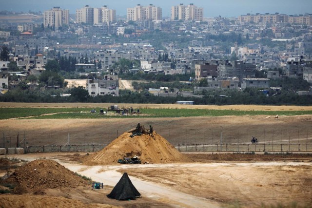 Israeli soldiers are seen in position on the Israeli side of the border fence between Israel and the Gaza Strip May 15, 2018. REUTERS/Amir Cohen