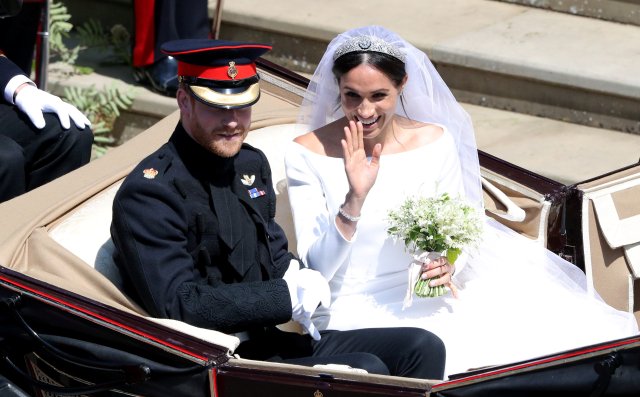 Prince Harry and Meghan Markle leave St George's Chapel in Windsor Castle after their wedding. Saturday May 19, 2018. Andrew Matthews/Pool via REUTERS