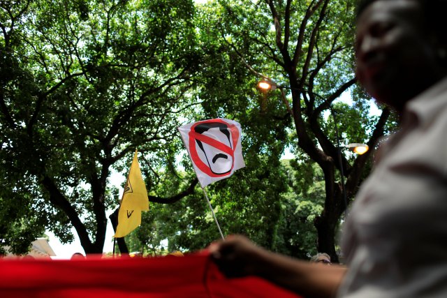 A placard depicting Venezuela's President Nicolas Maduro is seen during a protest against upcoming presidential elections, in Caracas, Venezuela May 16, 2018. REUTERS/Marco Bello