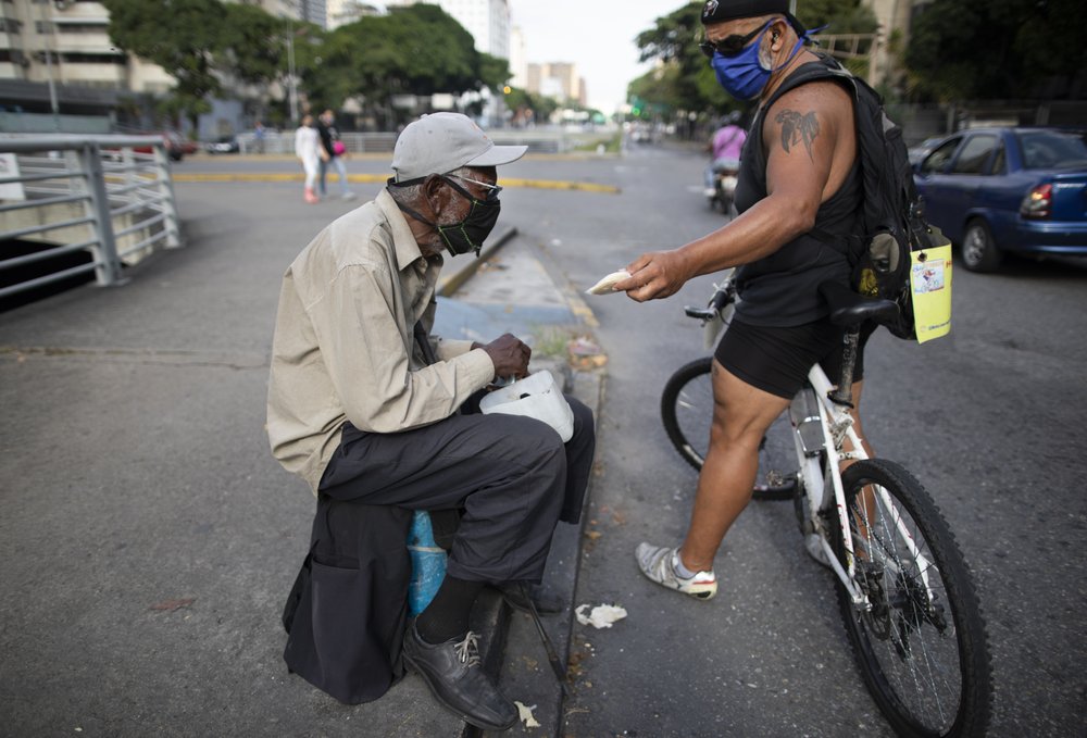 Ad exec feeds downtrodden Venezuelans from his bicycle seat