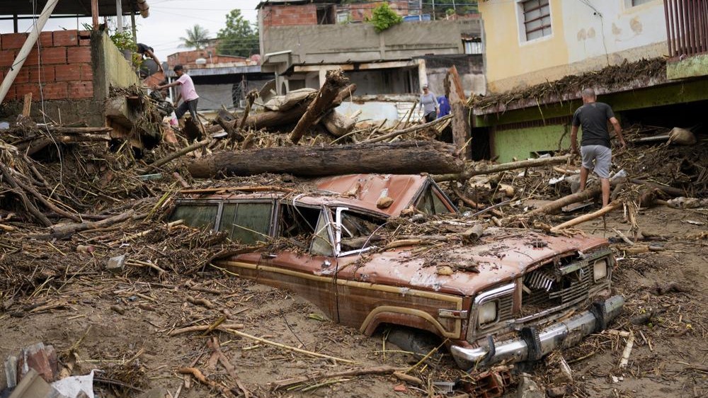 Rain-fueled landslide sweeps through Venezuela town; 22 dead